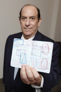 NEW YORK - FOR SUNDAY NEWS:  The man who flew too much, Steve Rothstein, 61, in his midtown Manhattan office, Manhattan, NY, on Wednesday, May 9, 2012.     PICTURED: Steve Rothstein holds his passport.   (Photo by Angel Chevrestt, 646.314.3206)